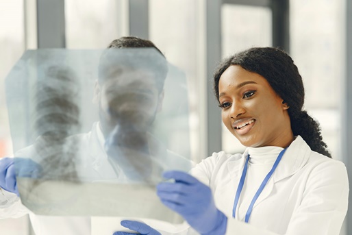 female doctor looking at x-rays